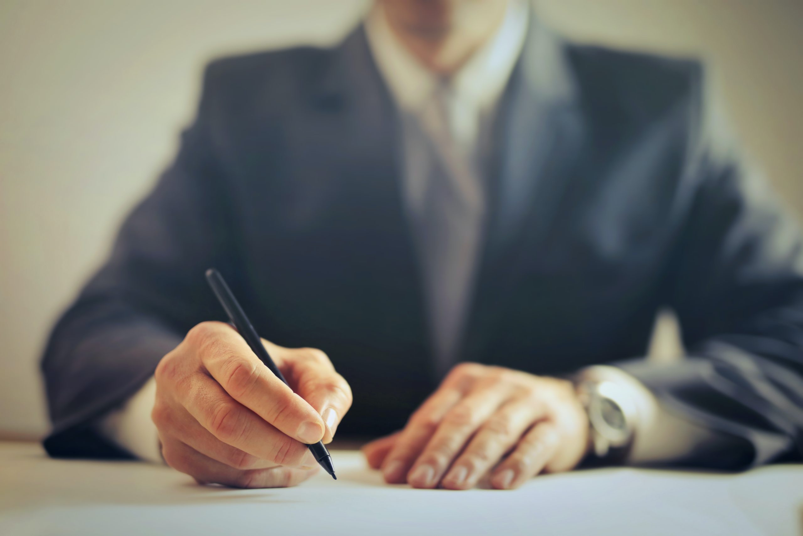 Lawyer signing a document